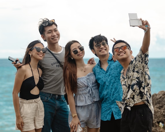 Friends taking a selfie by the sea